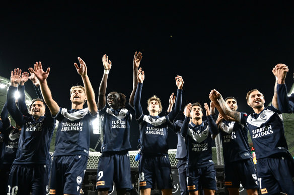 Victory players celebrate with their fans post game.