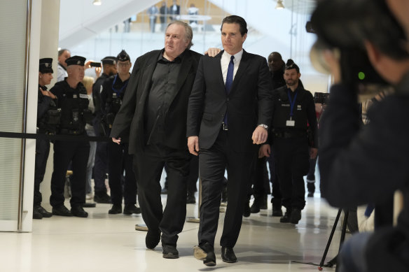 Gerard Depardieu, left, arrives at his trial this week for the alleged sexual assaults of two women on a film set in 2021, with his lawyer Jeremie Assous.