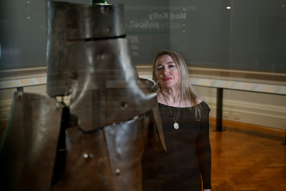 Joanne Griffiths with Ned Kelly’s armour at the State Library Victoria.