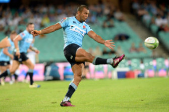 Kicker: Kurtley Beale launches the football downfield.