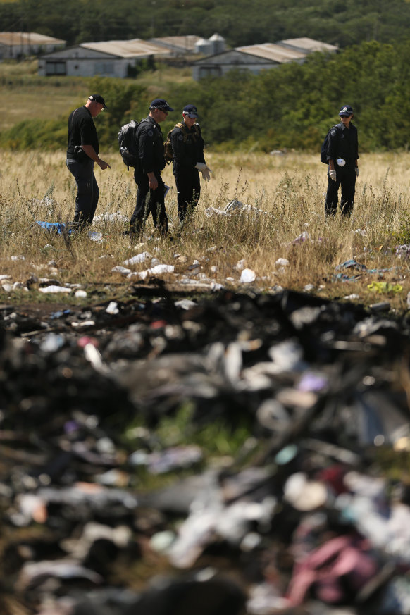 AFP and Dutch investigators search the site for human remains 
to repatriate.