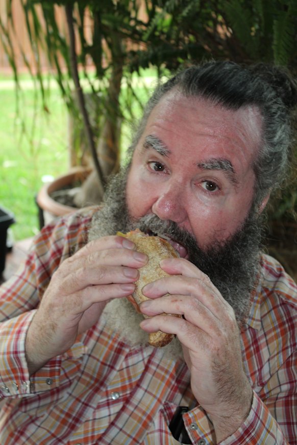 The author enjoying one of the famous rolls from Grocer and the Chef.