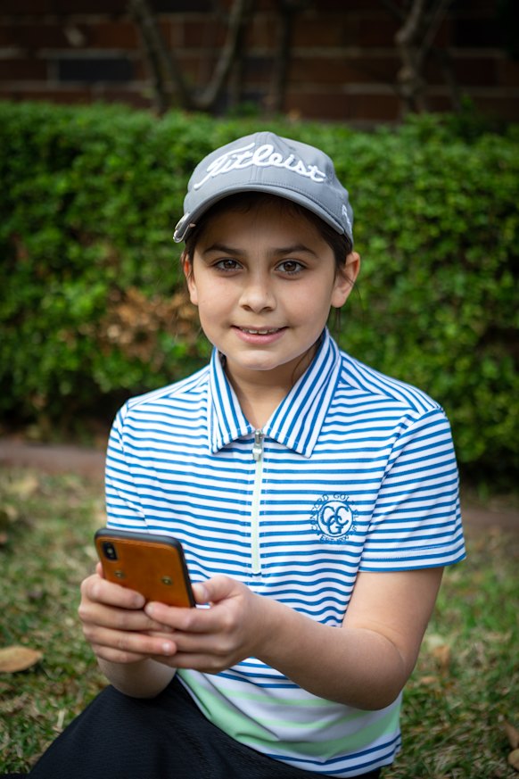 Sahara Hillman-Varma using Spriggy, a digital pocket money app.