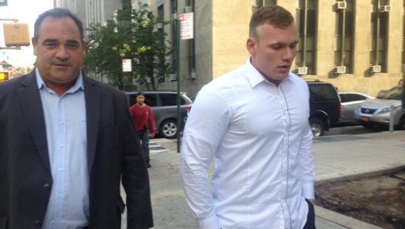 Matthew Lodge with his father in New York for a court appearance in 2015. 