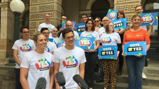 Emily Seebohm (front left) and Mitch Larkin (front right) speak at the launch of the national #PostYourYES campaign in Brisbane.