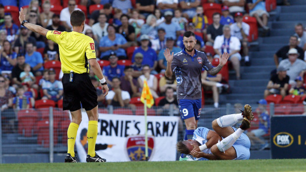 Early doors: Roy O'Donovan of the Jets fouled Jordy Buijs in the 13th minute and was sent off.
