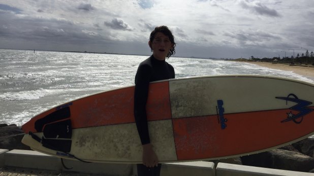 A "Groyne Rider" with his board.