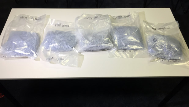 The pills weigh about 7.3kg. Police estimate there are 24,000 pills in the bags.