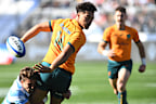 Jordan Petaia of Australia attempts to avoid a tackle.
