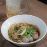 Kuy teav, the clear, pork- and dried-shrimp-based broth and its various toppings.