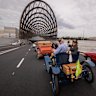 Louise Karch (right) in her vintage car about to drive through the tunnel.