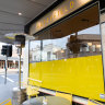 ‘Storm in a teacup’: Cafe ordered to remove yellow signage because it needed council permission