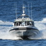 Volunteers on board Marine Rescue vessel Botany Port Hacking 30 searching for a missing rock fisher.