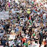 Protesters taking part in August 2025’s March for Palestine in Brisbane, which attendance estimates of XX,000 people.