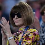 Vogue editor Anna Wintour applauds after watching Serena Williams of the United States defeat Simona Halep of Romania during day eight of the Australian Open tennis tournament in Melbourne.