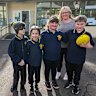 Hoddles Creek Primary School principal Leanne Timoney and her students.