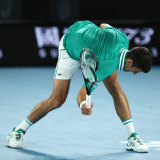 World No.1 Novak Djokovic smashes his racquet on the court during this year’s Australian Open.