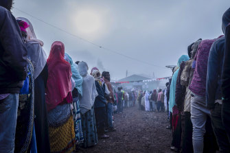 Ethiopians queue in the early morning to cast their votes in the general election in Beshasha on Monday.