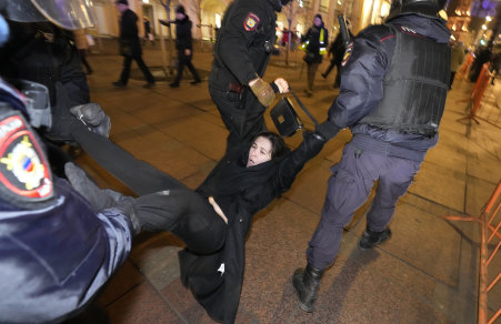 Police detain a demonstrator during an action against Russia’s attack on Ukraine in St. Petersburg, Russia.