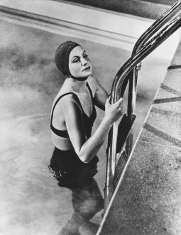 Greta Garbo in a swimsuit entering a swimming pool in the film ‘Two-Faced Woman’, 1941.