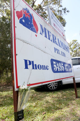 Flowers left at the entrance of Meramist Abattoir in Caboolture on Friday.