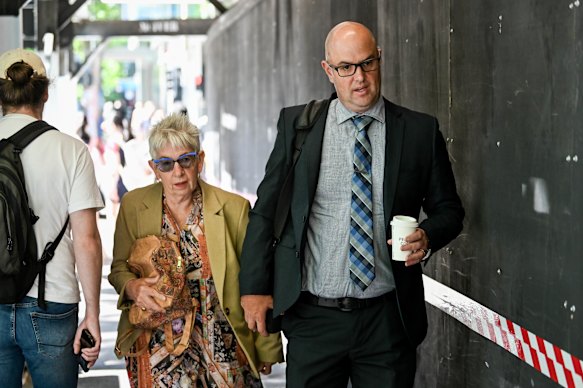 Gayle Armstrong, sister of Suzanne, and Detective Senior Sergeant Paul Rowe arrive at court.