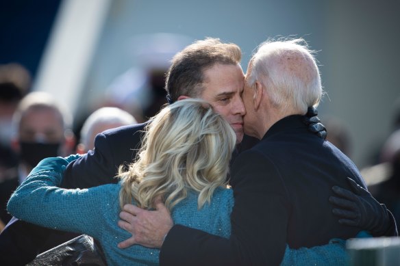 Hunter Biden embraces his father and his mother Jill Biden during Joe Biden’s presidential inauguration ceremony in Washington in January 2021.