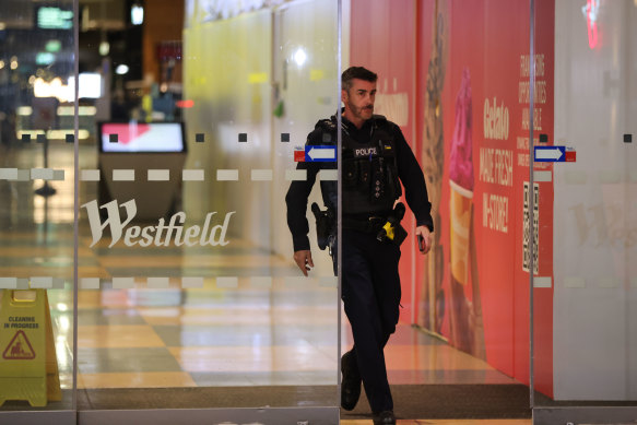 A police officer at Westfield Marion Shopping Centre in Adelaide yesterday.