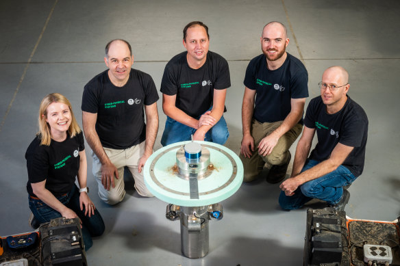 CSIRO robotics researcher Rosie Attwell (left) and team with the RCVD nuclear waste safety robot.