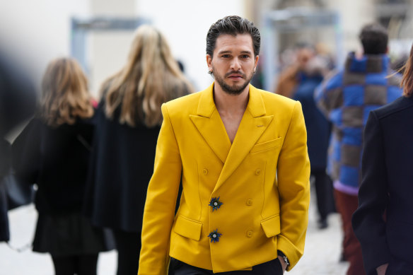 Kit Harington saves on ironing without a shirt at Louis Vuitton’s autumn/winter menswear show in Paris on January 19.