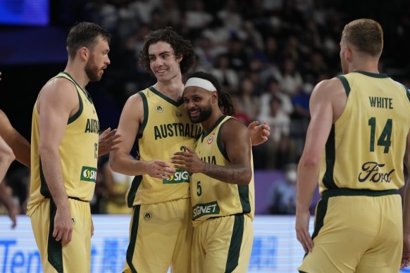 Boomers stars Josh Giddey (3) and Patty Mills (5) share a moment.