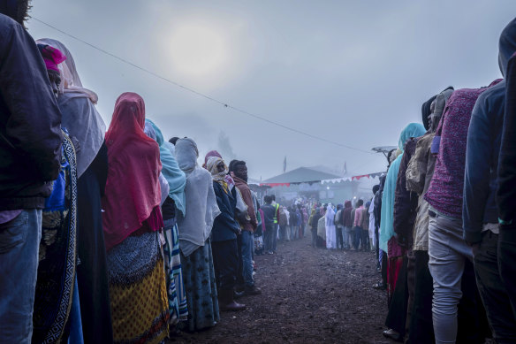 Ethiopians queue in the early morning to cast their votes in the general election in Beshasha on Monday.