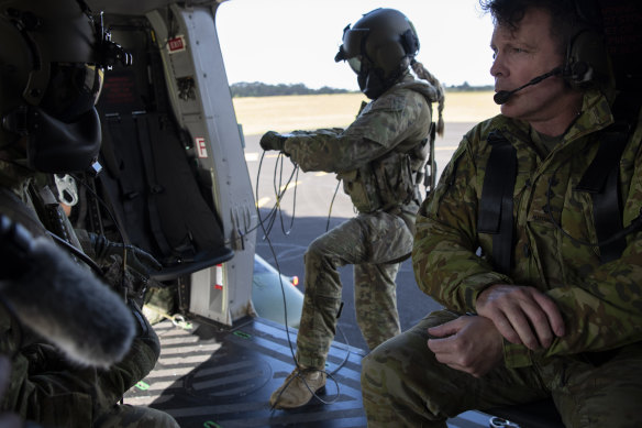 Colonel Warwick Young with ADF personnel prepare to depart Port Macquarie Airport. 
