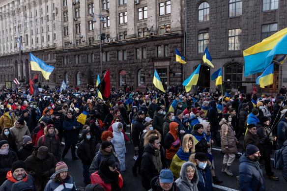 People participate in a Unity March to show solidarity and patriotic spirit over the escalating tensions with Russia on February 12, 2022 in Kiev, Ukraine.