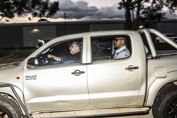 Jarryd Hayne speeds past media waiting outside prison.