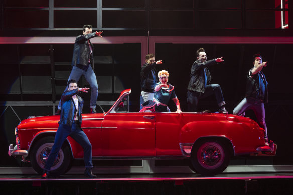 The cast of Grease, including Patti Newton (centre), at the Capitol Theatre in Sydney.