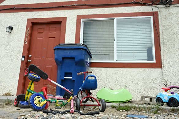 Bicycles and toys sit outside the townhouse where the Colorado suspect lived in Colorado Springs.