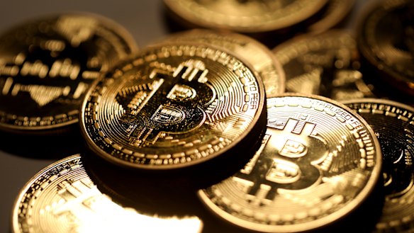 A pile of coins representing the otherwise intangible bitcoin.