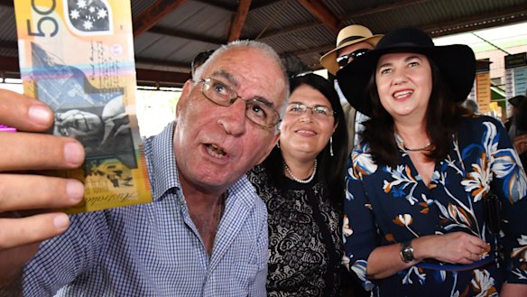 Premier Annastacia Palasczcuk place a Melbourne Cup bet while on the campaign trail.