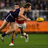 Nat Fyfe of the Dockers handpasses the ball.