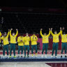 Australia celebrates on the podium after defeating Slovenia in the men’s bronze medal basketball game at the 2020 Summer Olympics, Saturday, Aug. 7, 2021, in Tokyo, Japan. (AP Photo/Charlie Neibergall)
