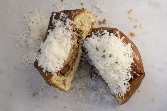 The eggplant parmigiana is a deep
pastry box with corners reminiscent of a knotted handkerchief, filled with rich tomato sauce-covered eggplant and festooned with mozzarella cheese.