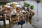 A man wades through floodwaters after heavy rain in Bangkok, Thailand, Tuesday, Sept. 29, 2026