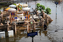 A man wades through floodwaters after heavy rain in Bangkok, Thailand, Tuesday, Sept. 29, 2026