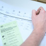 A person casts their vote at a polling booth on May 21.