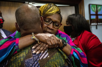 Ahmaud Arbery’s mother, Wanda Cooper-Jones is hugged by a supporter after the jury convicted the three white men in the murder of her son.