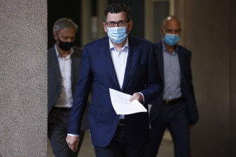 Premier Daniel Andrews (centre), Chief Health Officer Brett Sutton (left) and COVID-19 response commander Jeroen Weimar on Wednesday.