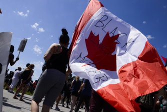 People take part in an anti-racism protest on Parliament Hill during the coronavirus pandemic in Ottawa, Ontario, on Friday.