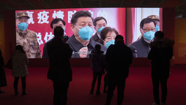 Residents attend an exhibition on the city’s fight against the coronavirus in Wuhan on January 23, a year after it was locked down to contain the spread of coronavirus.