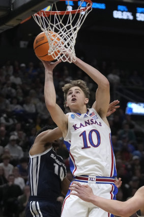 Johnny Furphy drives to the basket against Samford in a college basketball game in Salt Lake City.